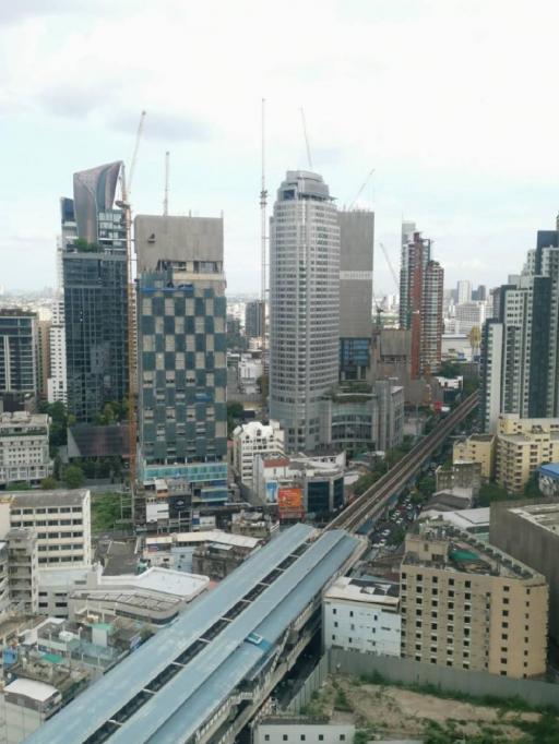 High-rise cityscape with skyscrapers and metro rail