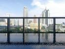 Urban skyline view from a building with reflections in a pool