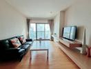 Spacious living room with natural light and modern furniture