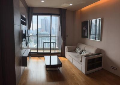 Modern living room with large window and city view