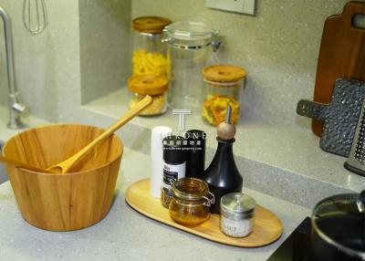 Close-up of kitchen countertop with various utensils and condiments