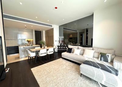 Spacious living room with modern furniture and open plan to dining and kitchen
