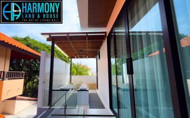 Modern patio with large glass doors and a view of the clear sky