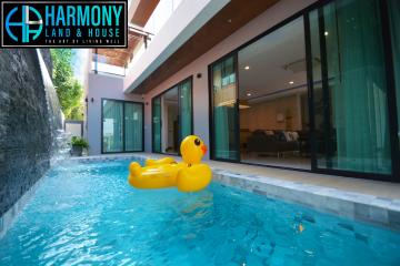 Luxurious indoor pool area with giant rubber duck float