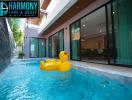 Luxurious indoor pool area with giant rubber duck float