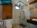 Modern bathroom with wooden accents and glass shower
