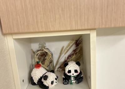 Decorative pandas on a shelf