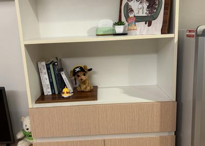 Modern shelving unit with decorative items and books in a living space