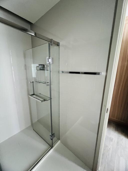 Modern bathroom with glass shower enclosure.