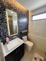 Contemporary bathroom with mosaic tile backsplash