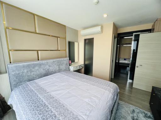 Elegantly furnished bedroom with large bed and modern design