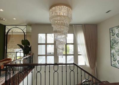 Elegant interior with crystal chandelier and open concept design