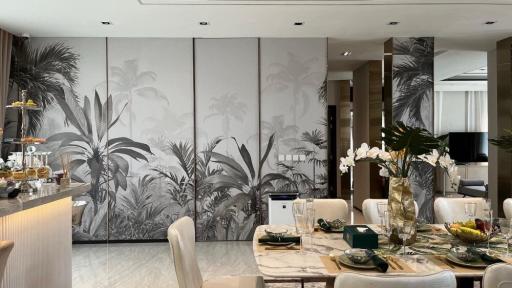 Elegant dining area with tropical wall mural and modern furnishings