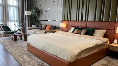 Elegantly designed modern bedroom with a large bed and stylish furnishings