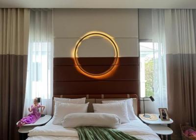 Modern bedroom with stylish lighting and comfortable setting