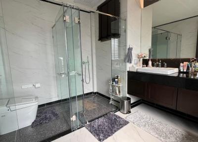 Modern bathroom with glass shower enclosure and double vanity