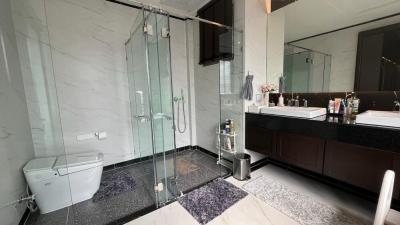 Modern bathroom with glass shower enclosure and double vanity