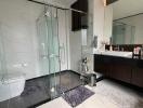 Modern bathroom with glass shower enclosure and double vanity