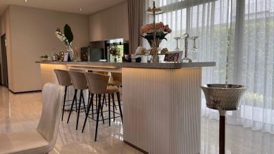 Modern kitchen with bar seating and natural light