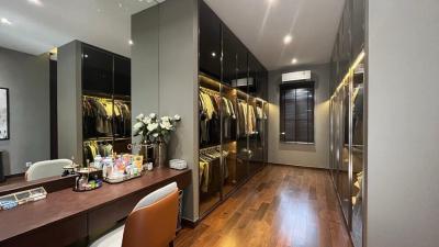Modern bedroom with large mirrored wardrobe and stylish dressing table