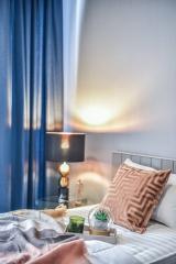 Cozy Bedroom Interior with Soft Textiles and Ambient Lighting