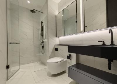 Modern bathroom with glass shower and elegant fixtures