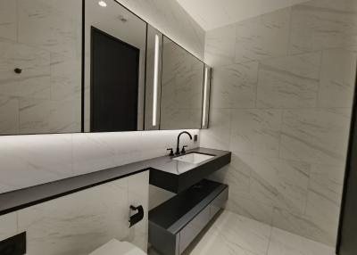 Modern bathroom with marble walls and sleek design