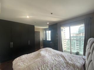 Spacious bedroom with large bed and built-in wardrobe