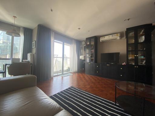 Spacious living room with natural light and modern furniture