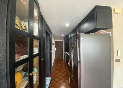 Spacious corridor with built-in storage and parquet flooring
