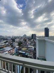 Panoramic city view from high-rise apartment balcony