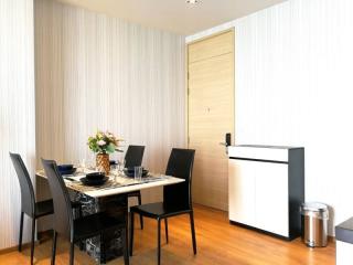 Modern dining room with elegant table setting and wooden floors