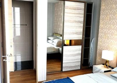 Modern bedroom with connecting bathroom and large wardrobe