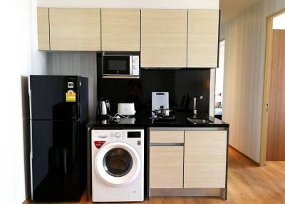 Modern kitchen with integrated appliances and ample cabinetry