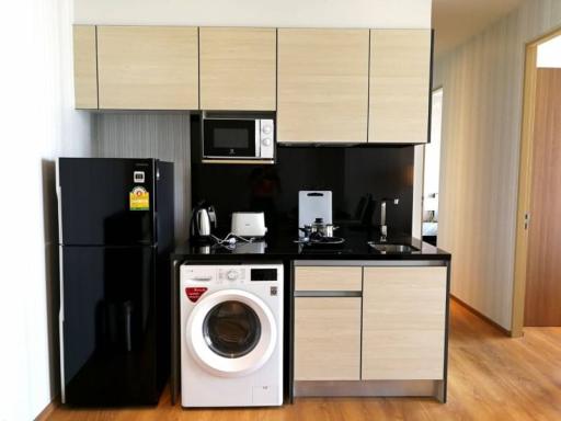 Modern kitchen with integrated appliances and ample cabinetry