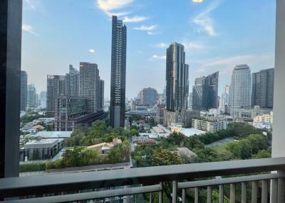 City view from high-rise apartment balcony at dusk