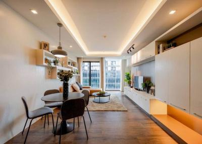 Modern and spacious living room with dining area and ample natural light