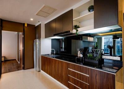 Modern kitchen with wooden cabinets and stainless steel appliances