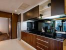 Modern kitchen with wooden cabinets and stainless steel appliances