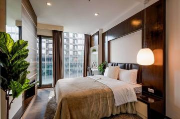 Cozy modern bedroom with natural light and city view