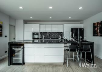 Modern Kitchen with Spacious Island and Integrated Appliances