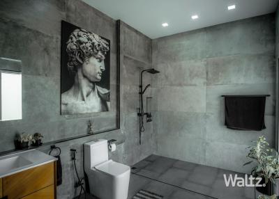 Contemporary bathroom with art, modern fixtures, and walk-in shower