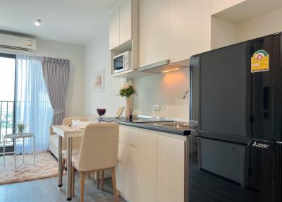 Modern kitchen interior with dining area and ample sunlight