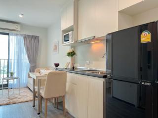 Modern kitchen interior with dining area and ample sunlight