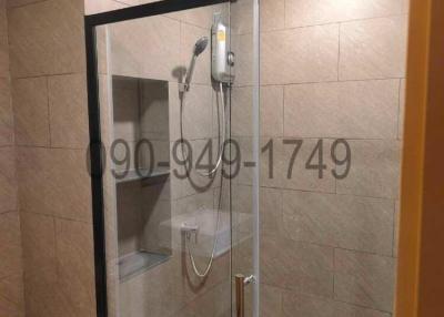 Modern bathroom interior with glass shower enclosure