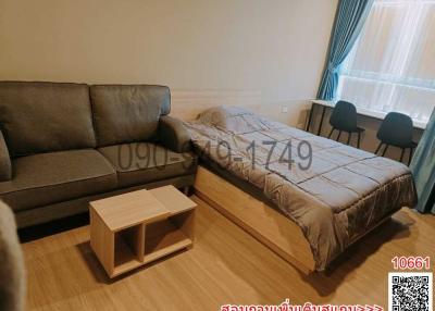 Compact bedroom with a sofa and a bed