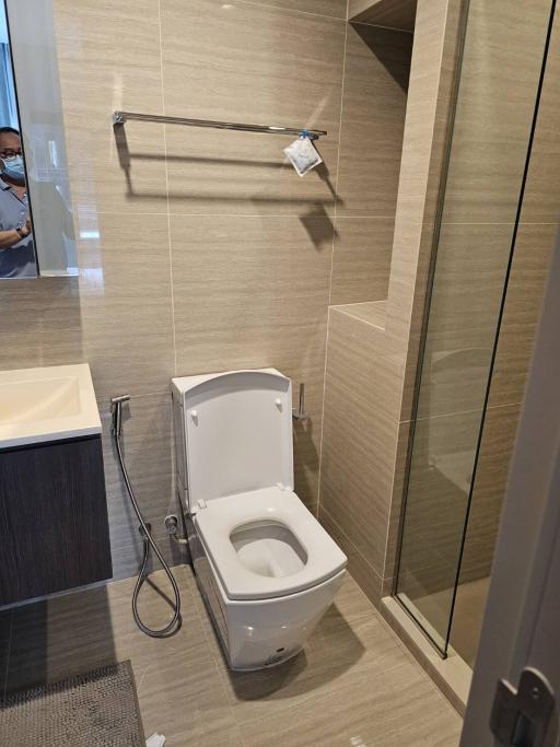 Modern bathroom interior with a toilet and shower