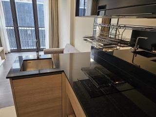 Modern kitchen with stainless steel sink and open plan layout