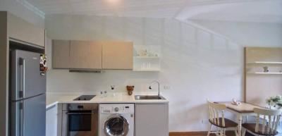 Modern kitchen with stainless steel appliances and dining area