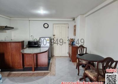 Spacious kitchen with attached dining area and tiled flooring